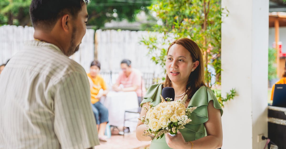 Bride Holding a Bouquet of White Roses and Giving a Speech at her Wedding